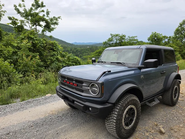 Our blue Ford Bronco at a mountain overlook